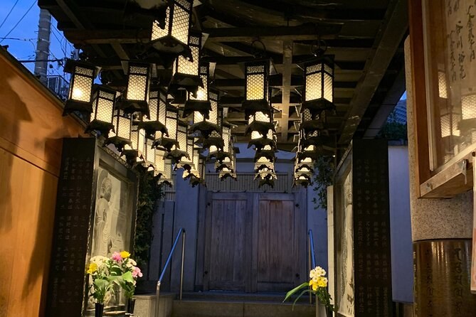 Lanterns strung above the stone lane at Hozenji Yokocho