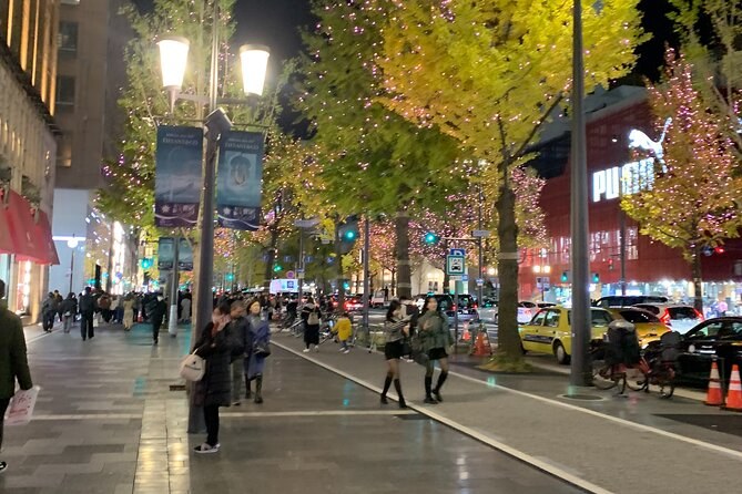 Midosuji's roadside trees lit up on a winter evening