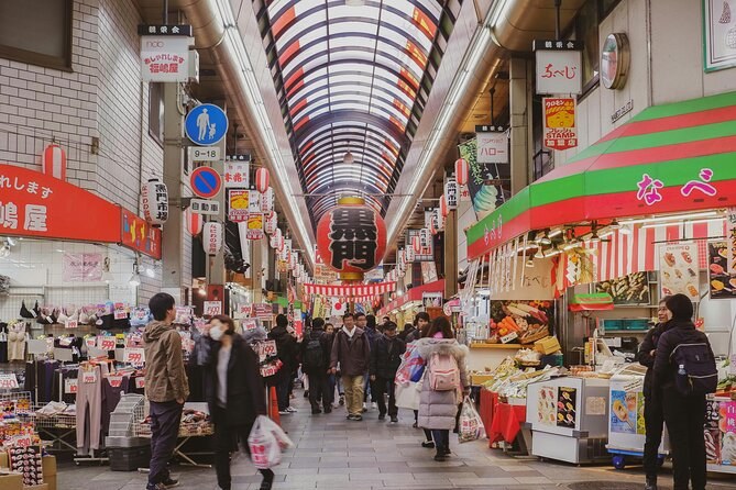 A covered Osaka shopping arcade running into the distance