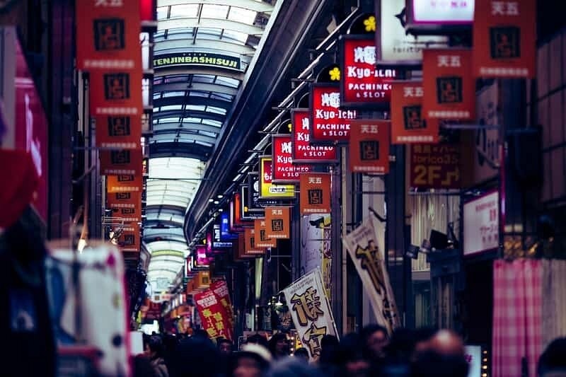 The Shinsaibashi covered arcade under its neon signage at night
